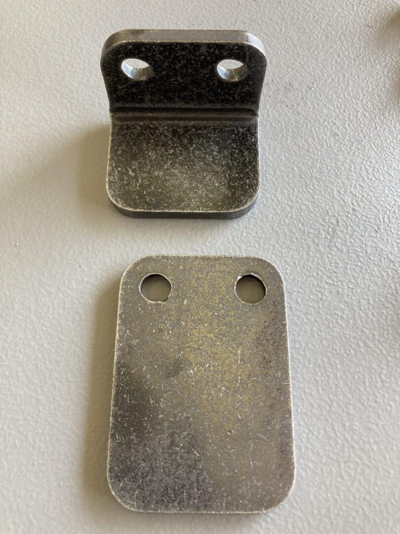 A Phone Mount consisting of two metal brackets on a table.